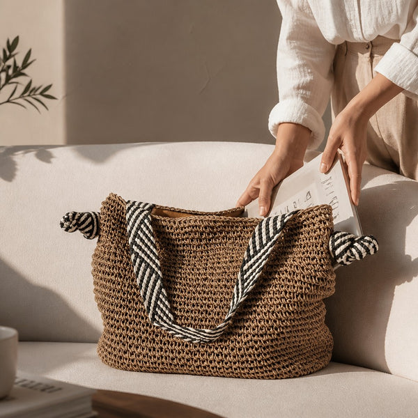 L and B Creations straw shoulder bag with black and white striped knot straps and light brown interior pocket